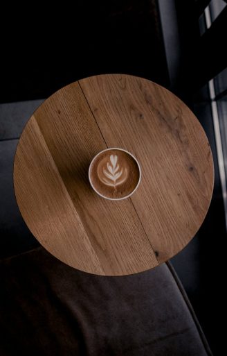 latte art in cup of coffee on a round table