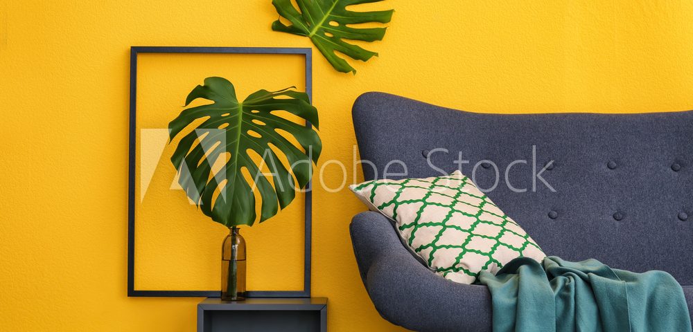 Elegant living room interior with comfortable sofa. Home design in rainbow colors