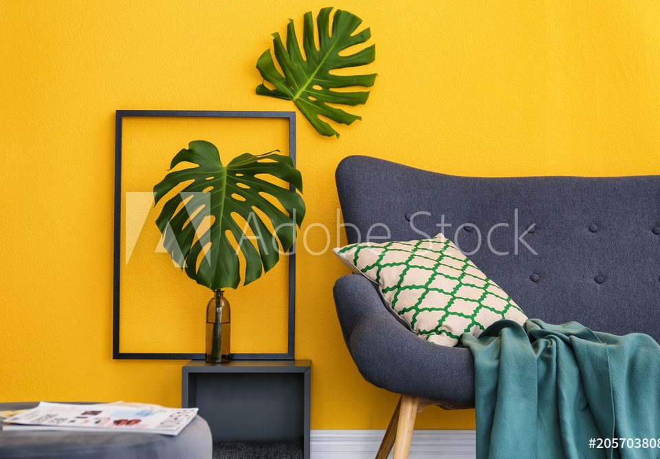 Elegant living room interior with comfortable sofa. Home design in rainbow colors