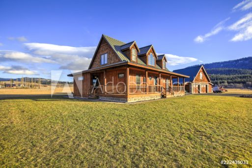Nice wooden ranch home with beautiful landscape in the countryside.