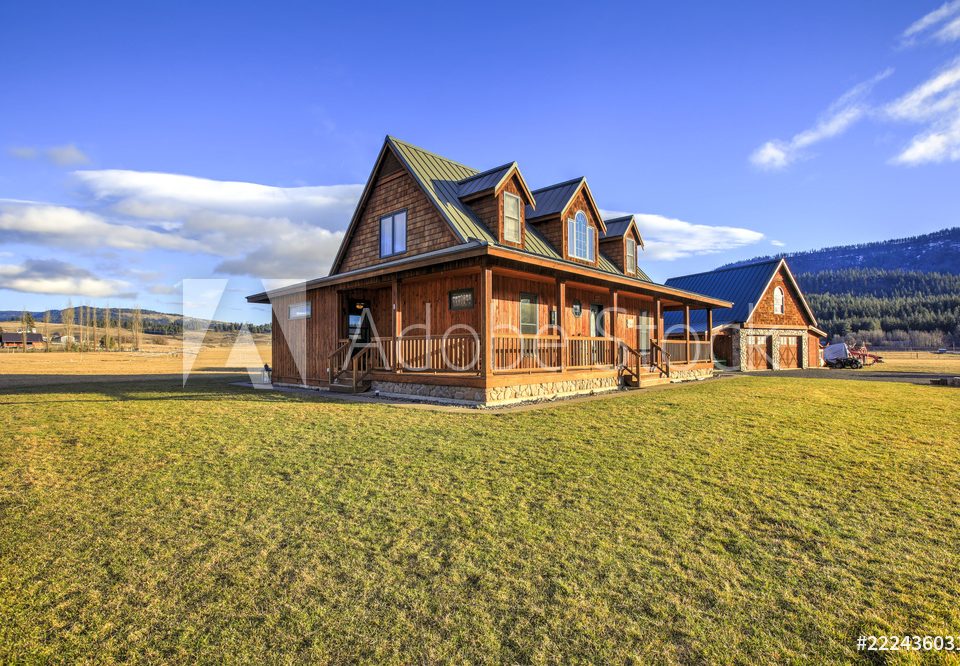 Nice wooden ranch home with beautiful landscape in the countryside.