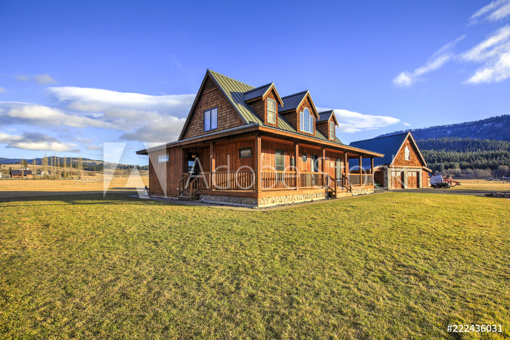 Nice wooden ranch home with beautiful landscape in the countryside.
