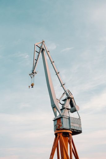 construction site with cranes in city